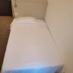 Letto della Camera Singola con luce naturale, Hotel Accademia Trento centro storico